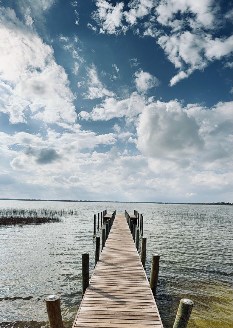 Wooden pier extending over Florida water Wooden pier extending over Florida water