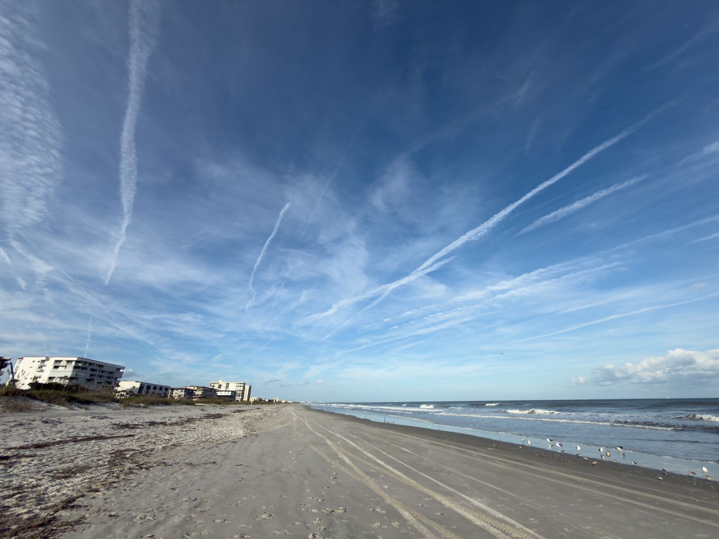 Beach with pale sand and blue sky Beach with pale sand and blue sky
